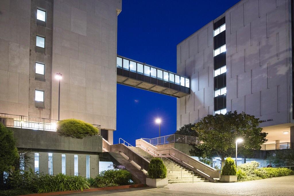 Exterior of the SF State College of Science and Engineering building at night.